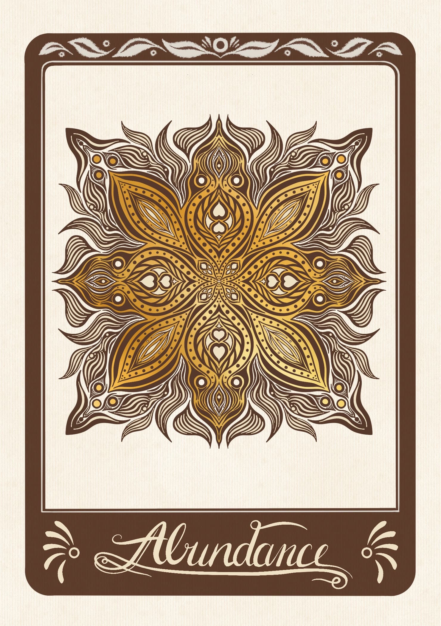 An intricate symmetrical gold and bronze floral mandala with heart accents on textured cream card, above a brown plaque reading "Abundance".