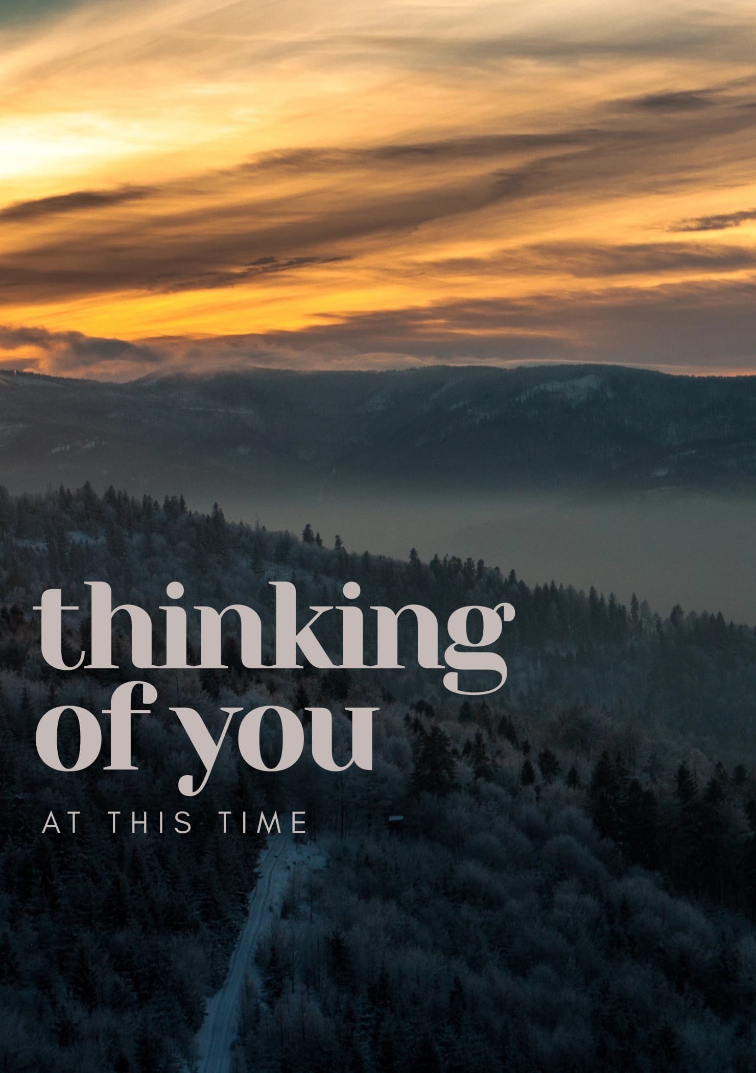 Photo of a misty mountain view, trees and a sunset. The caption reads "Thinking of you, at this time".